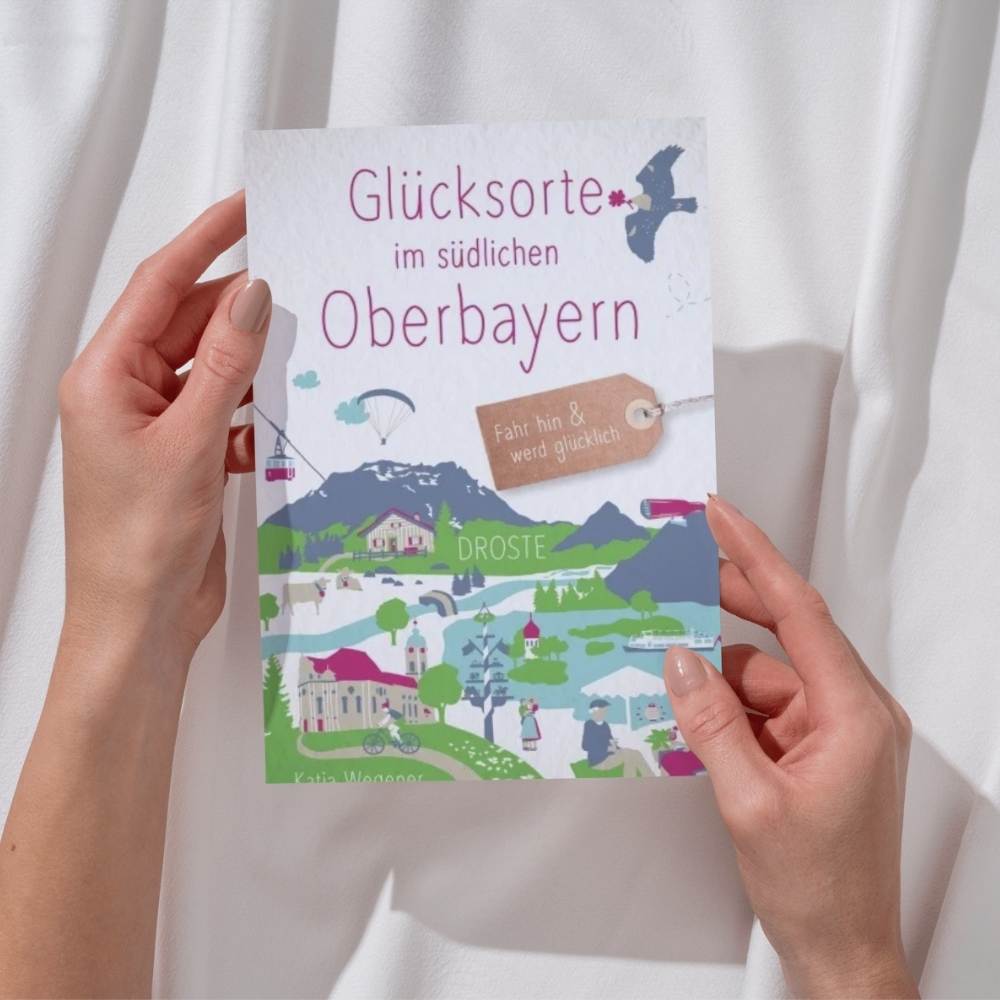 Hoamat Gfui Buch Glücksorte im südlichen Oberbayern gehalten in der Hand von einer Frau